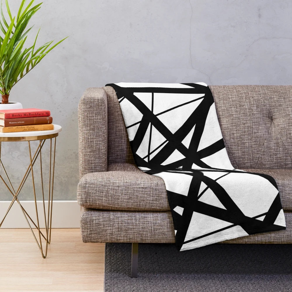 Plush blanket with black and white stripes inspired by Eddie Van Halen's iconic guitar design