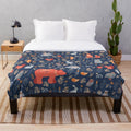 Plush blanket featuring a fairy-tale forest scene with woodland animals and floral patterns