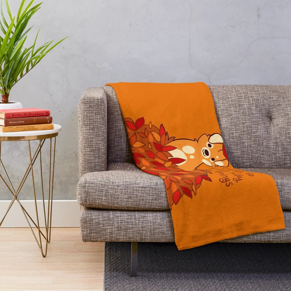 Plush blanket with fall leaves and puppy design