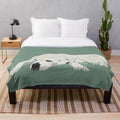 Plush blanket with an illustration of a large, furry dog