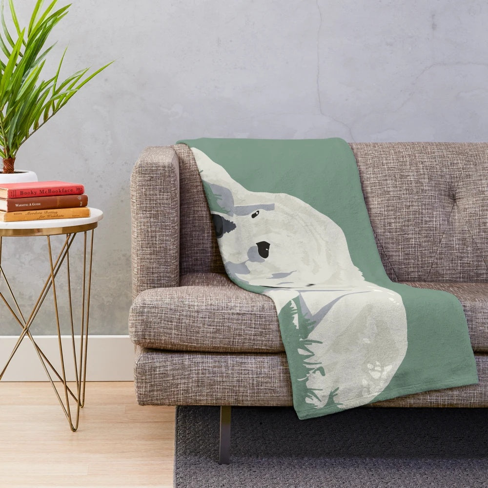 Plush blanket with an illustration of a large, furry dog