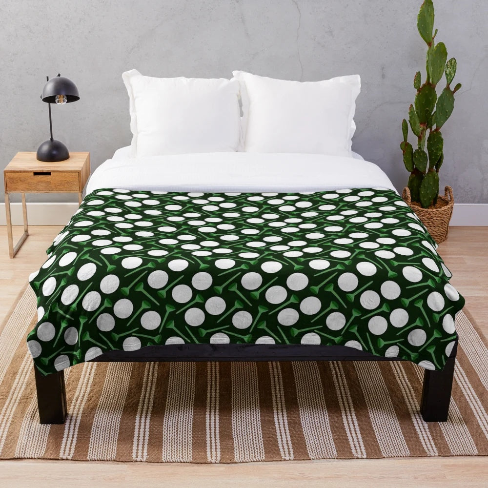 Plush blanket with golf balls and tees pattern