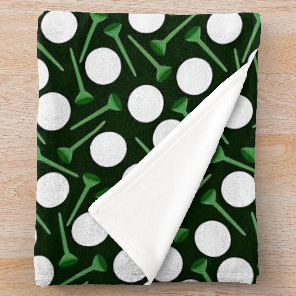 Plush blanket with golf balls and tees pattern