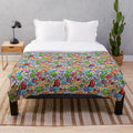 Plush blanket with colorful hobby-themed patterns and designs