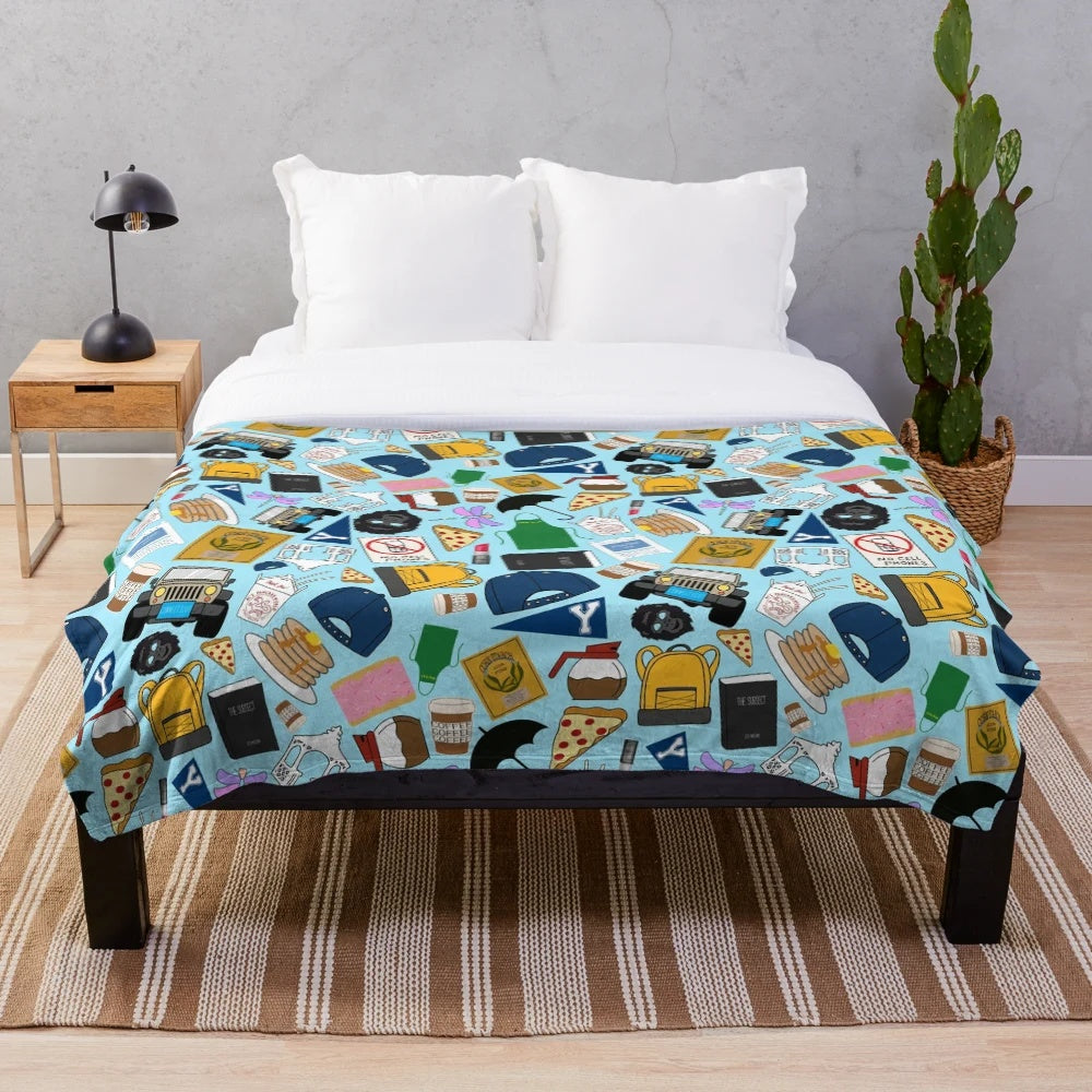 Plush blue blanket with all-over print of Gilmore fan patterns