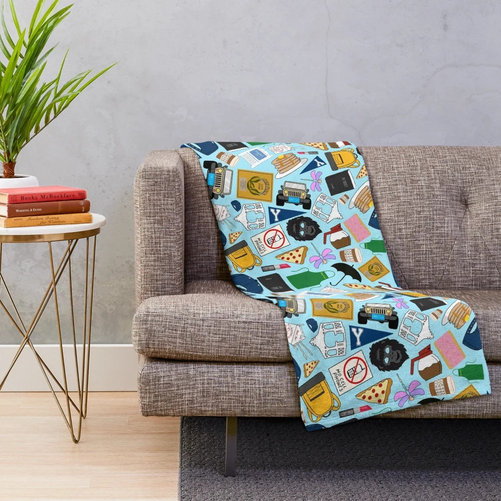 Plush blue blanket with all-over print of Gilmore fan patterns