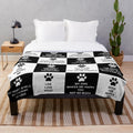 Plush dog lover blanket with black and white checkered pattern and dog quotes