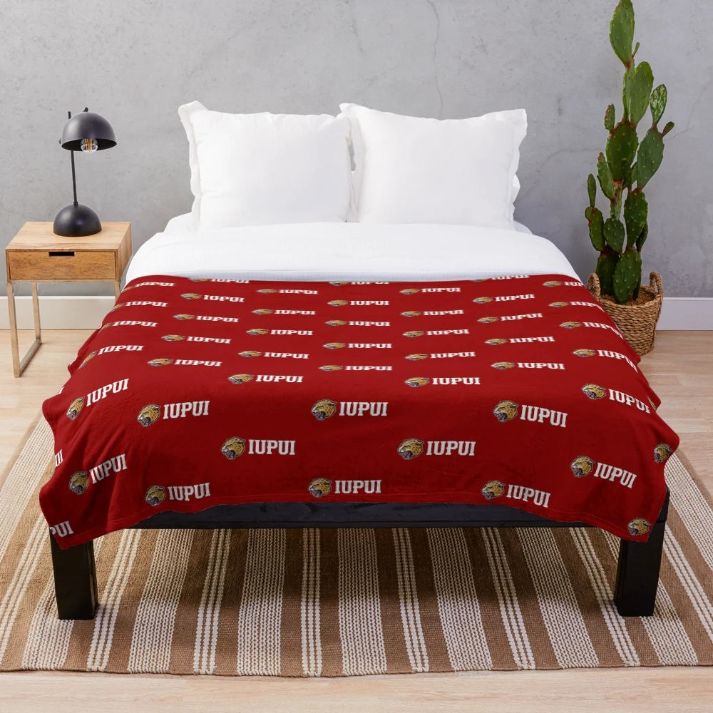 Soft and comfortable plush blanket featuring the IUPUI Jaguars logo and wordmark
