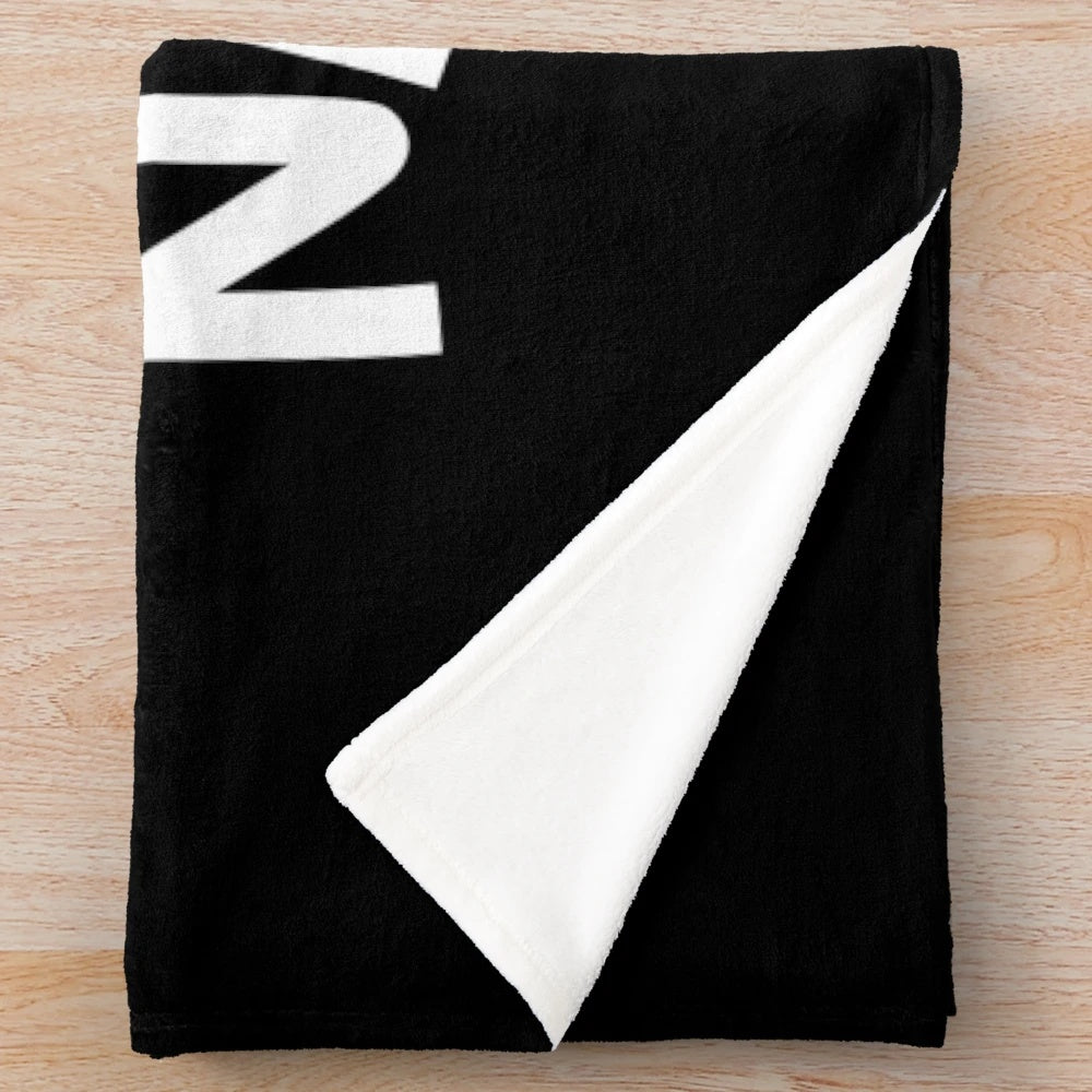 Plush blanket featuring a lazy raccoon design, perfect for sleep lovers and nappers.