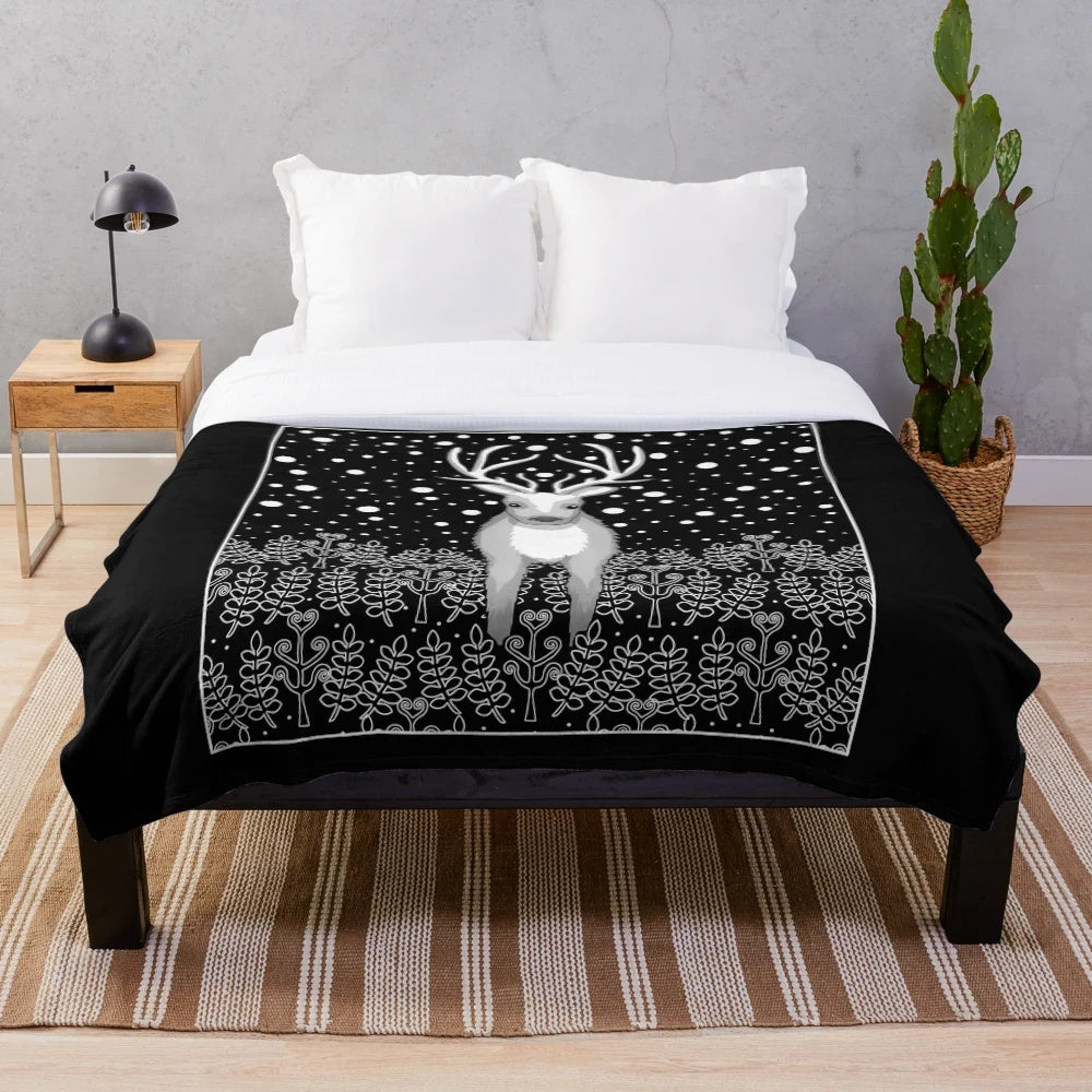 Cozy plush blanket featuring a deer, reindeer, and elk design
