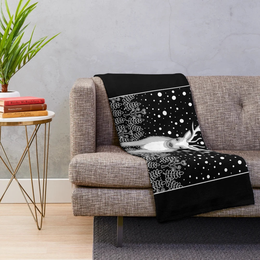 Cozy plush blanket featuring a deer, reindeer, and elk design