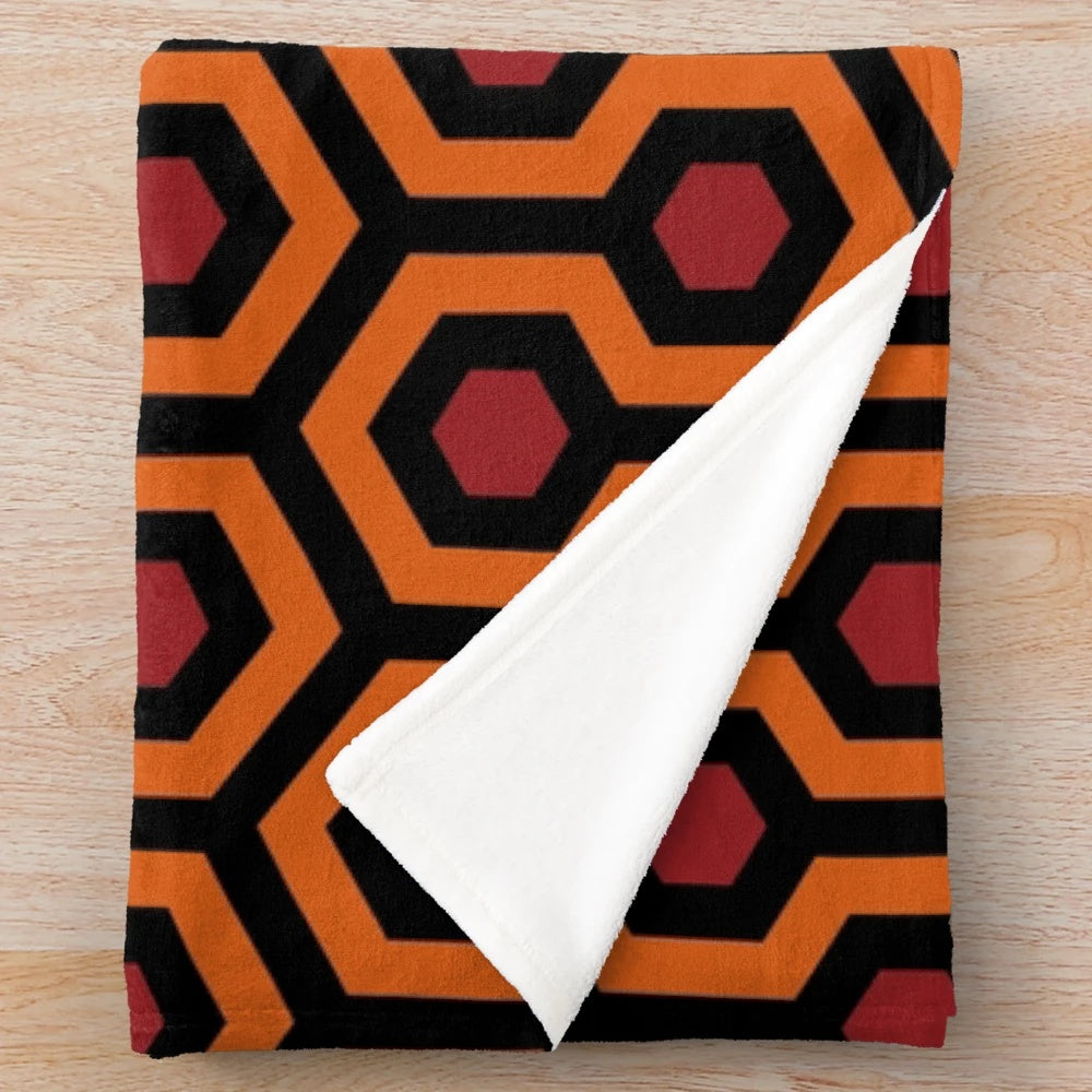 Cozy plush blanket featuring a looped hexagon geometric pattern