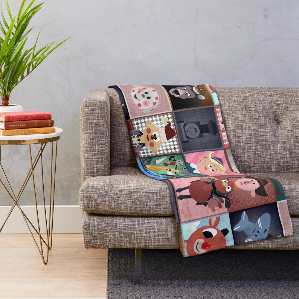 Plush blanket with squares featuring characters from Rudolph the Red-Nosed Reindeer