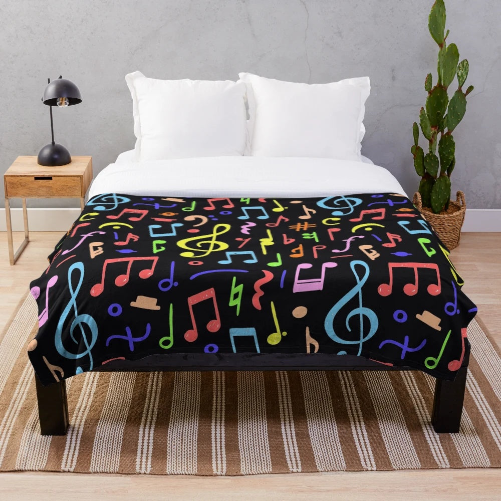Plush blanket with a vibrant music note pattern design