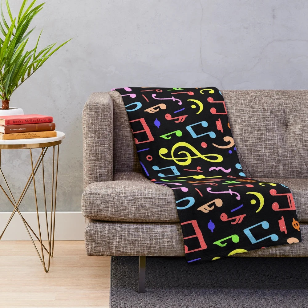 Plush blanket with a vibrant music note pattern design