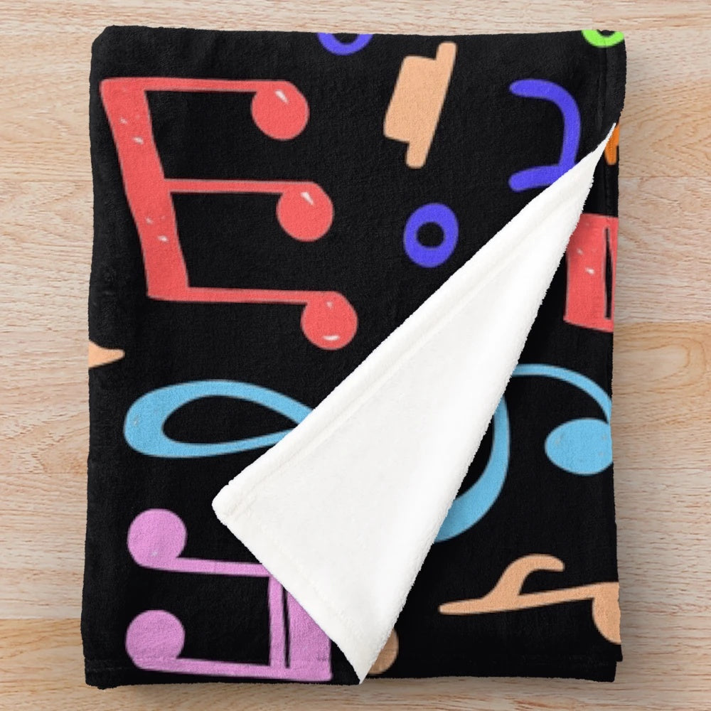 Plush blanket with a vibrant music note pattern design