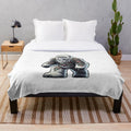 Plush blanket featuring an embroidered mythical creature design