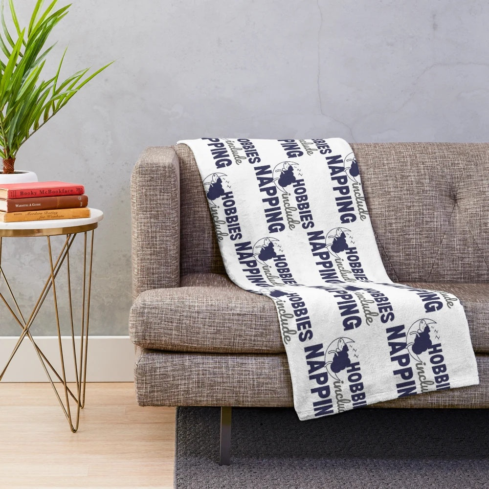 Plush blanket with a design of sheep napping, perfect for cozy naps and relaxation