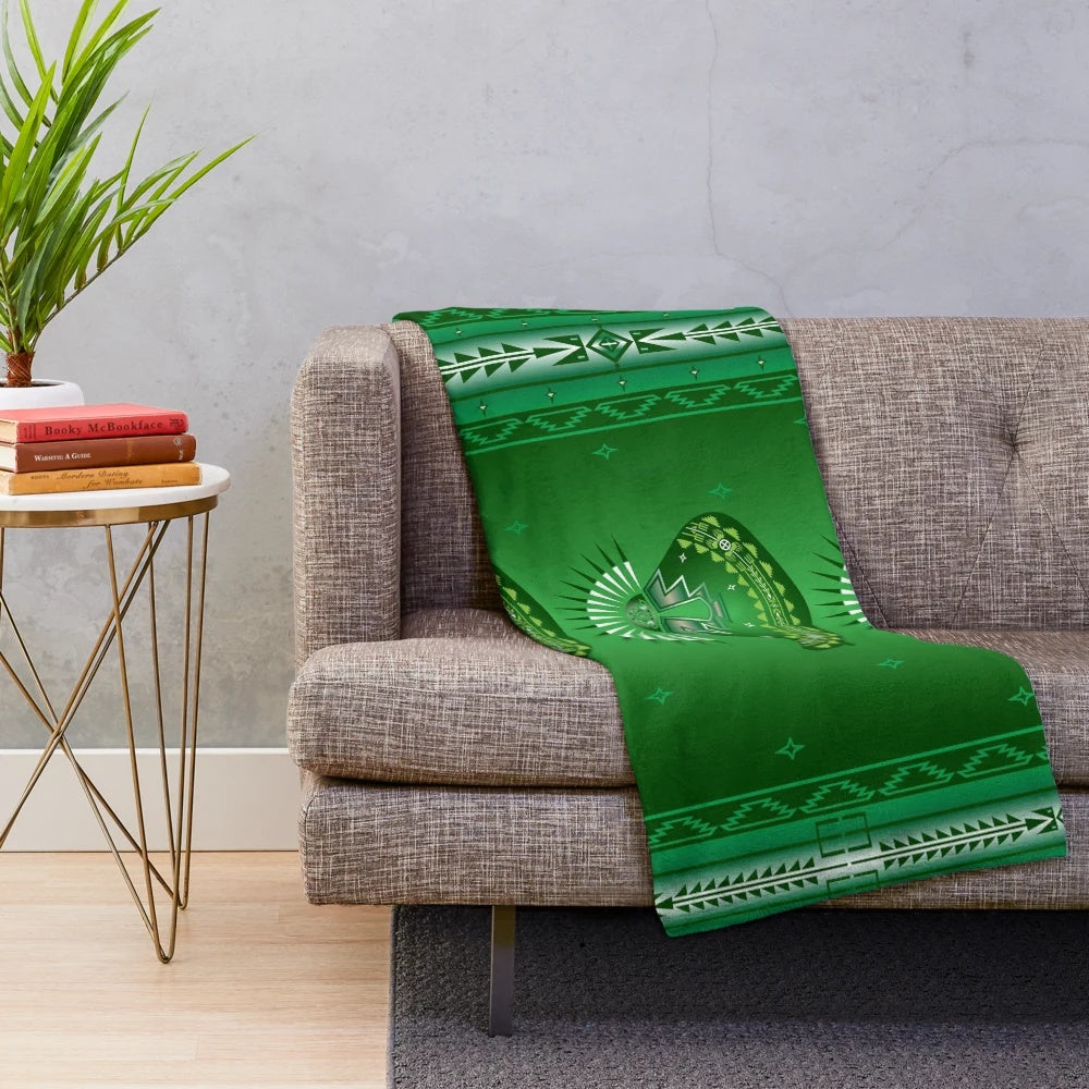 Plush green blanket with native american inspired wildlife and circle design
