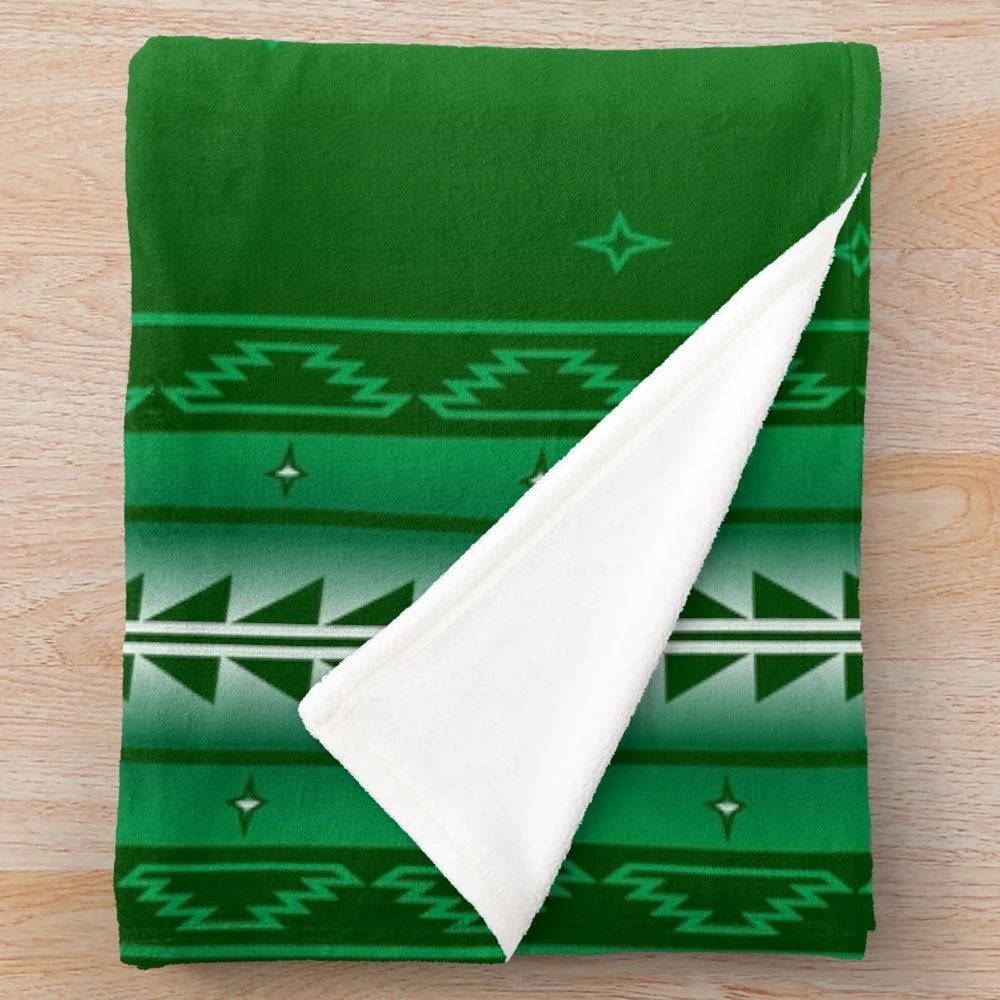 Plush green blanket with native american inspired wildlife and circle design