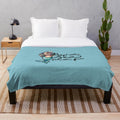 Soft and cuddly plush blanket featuring a marine life design, promoting plastic-free living.