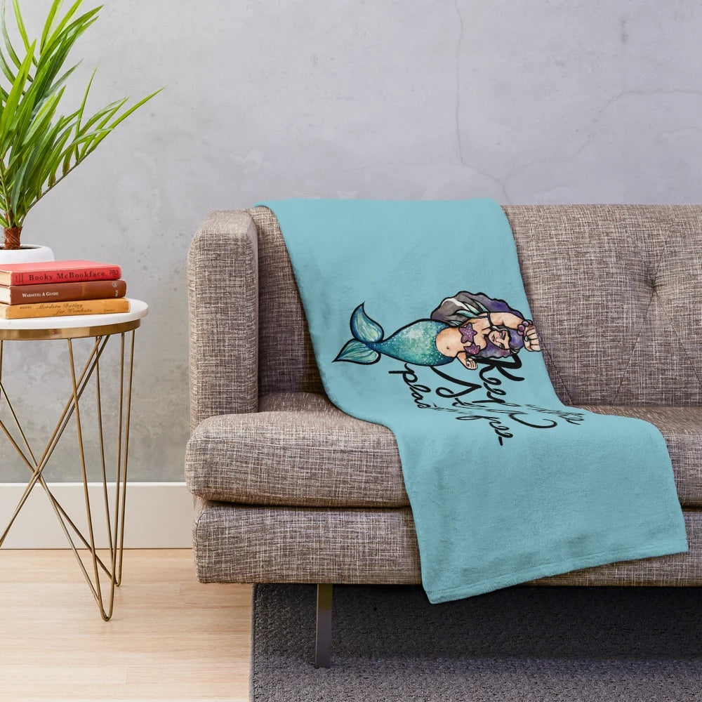 Soft and cuddly plush blanket featuring a marine life design, promoting plastic-free living.