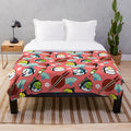 Soft plush blanket featuring a design of lovebirds and sushi