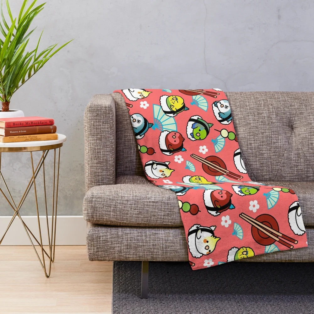 Soft plush blanket featuring a design of lovebirds and sushi