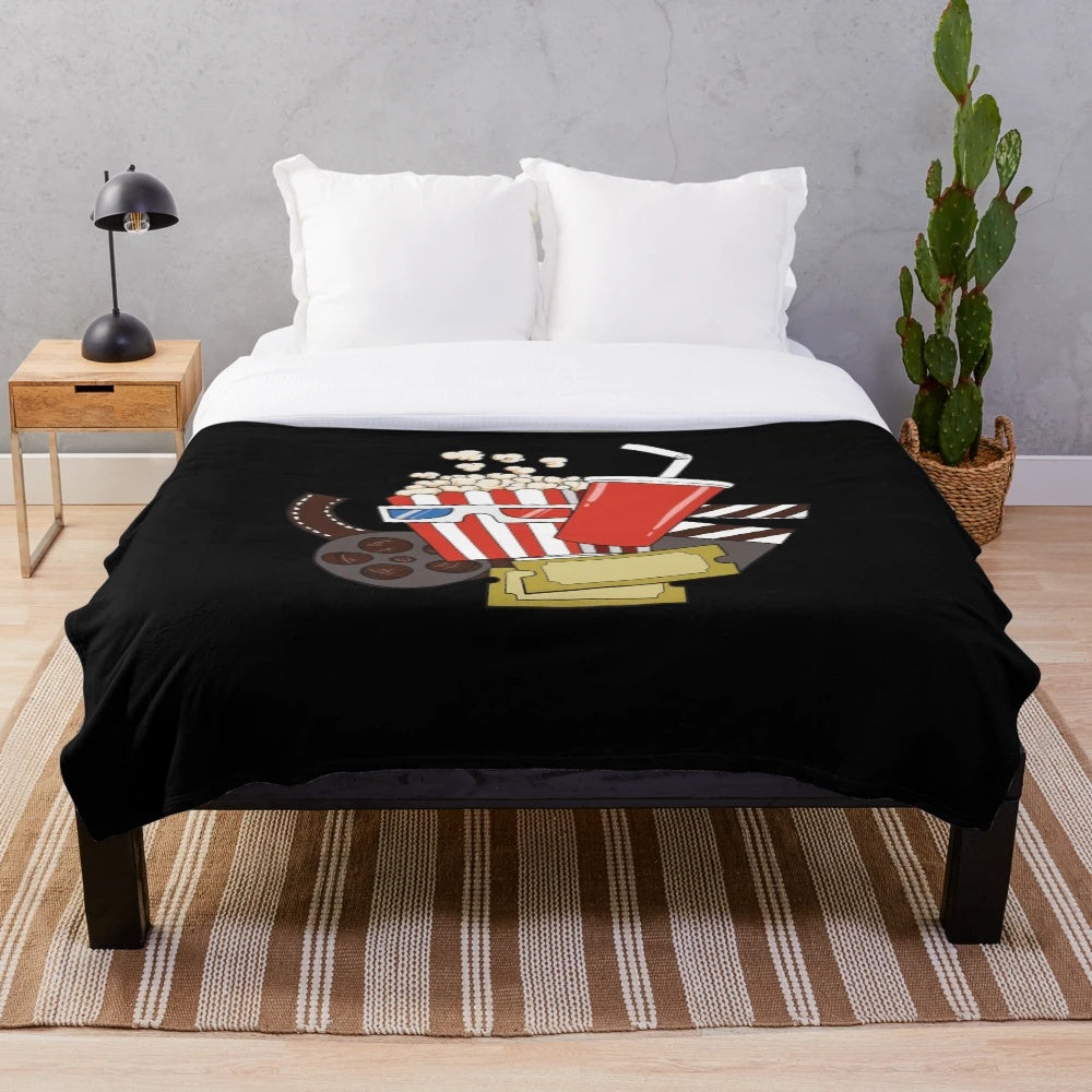 Plush blanket with a popcorn design for film fans and movie enthusiasts