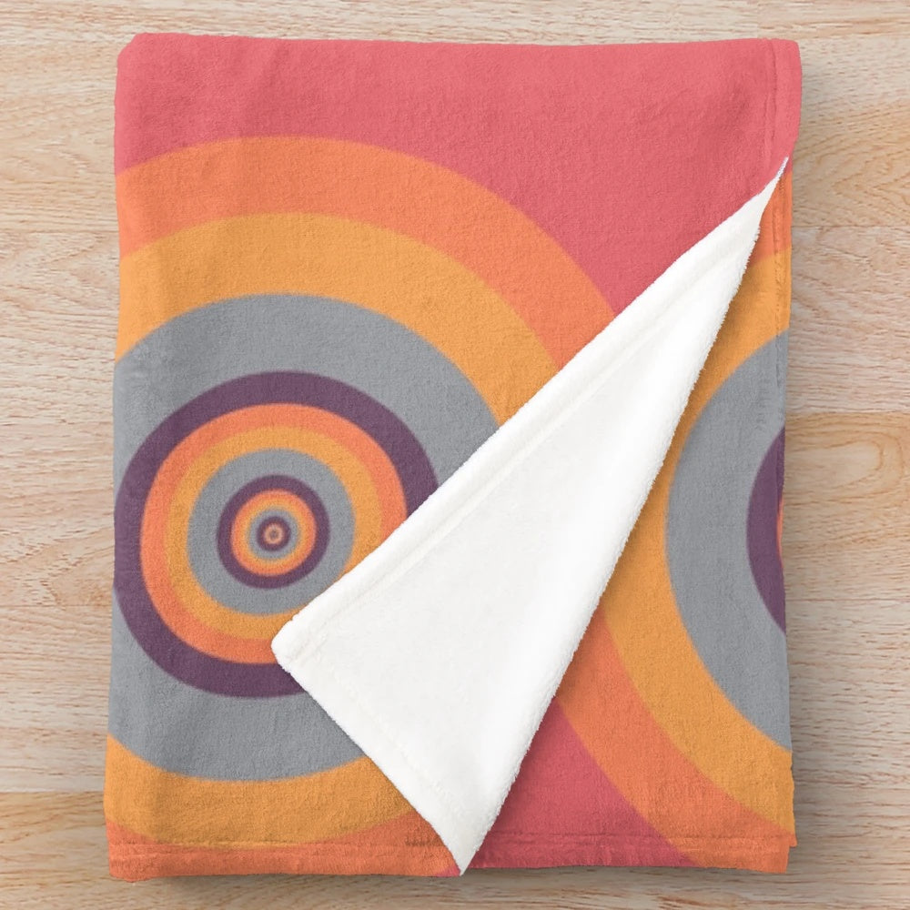 A cozy plush blanket featuring mesmerizing psychedelic fractal patterns.