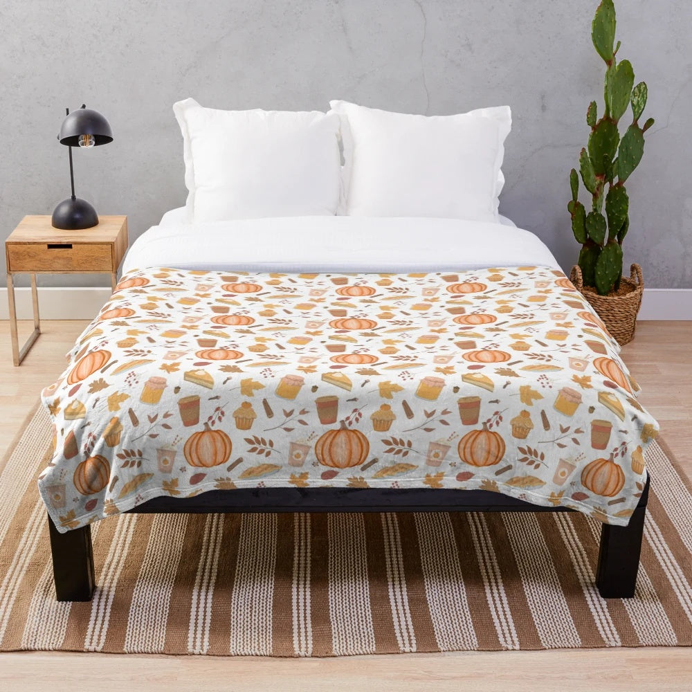 Cozy plush blanket with whimsical pumpkin patch design for fall home decor