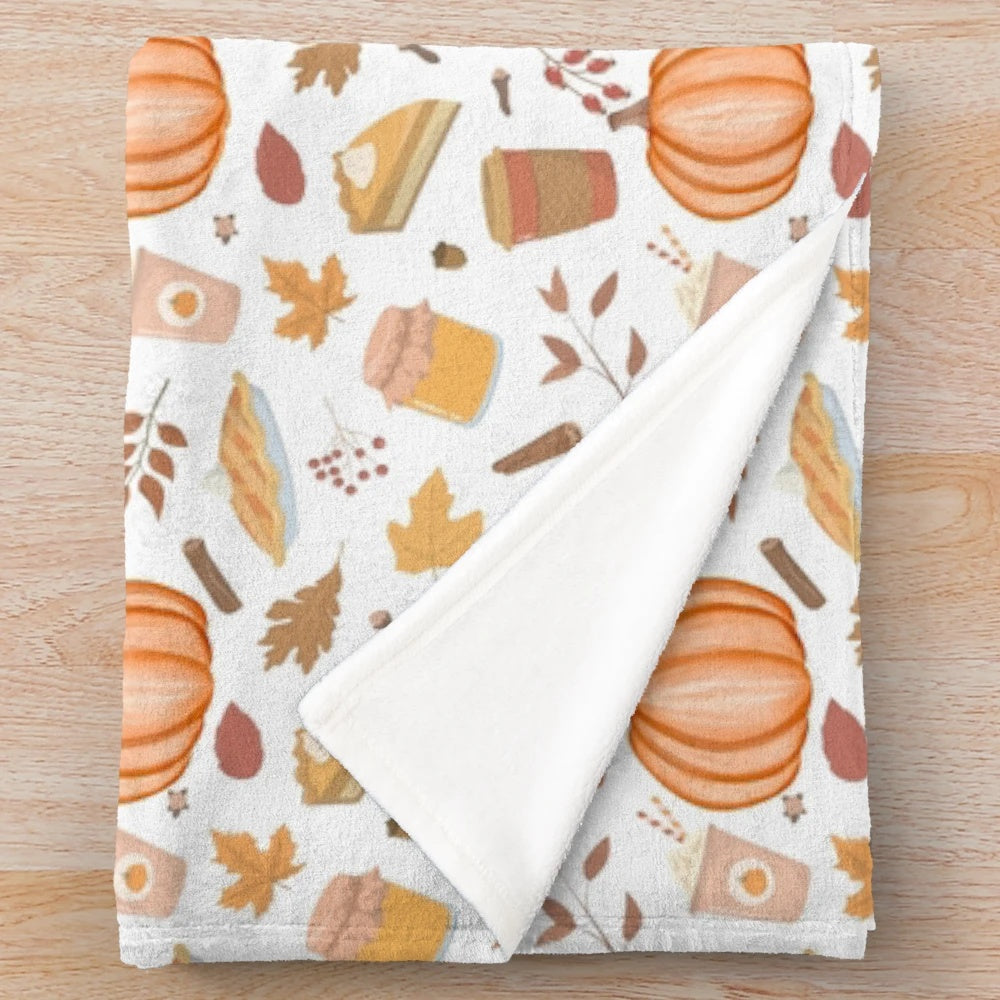 Cozy plush blanket with whimsical pumpkin patch design for fall home decor