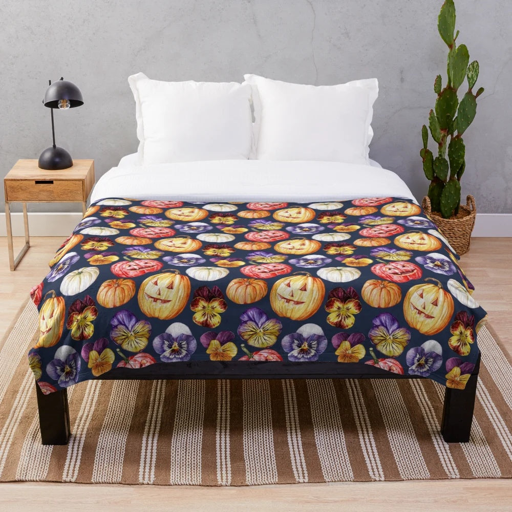Plush blanket with watercolor pattern of pumpkins and pansies
