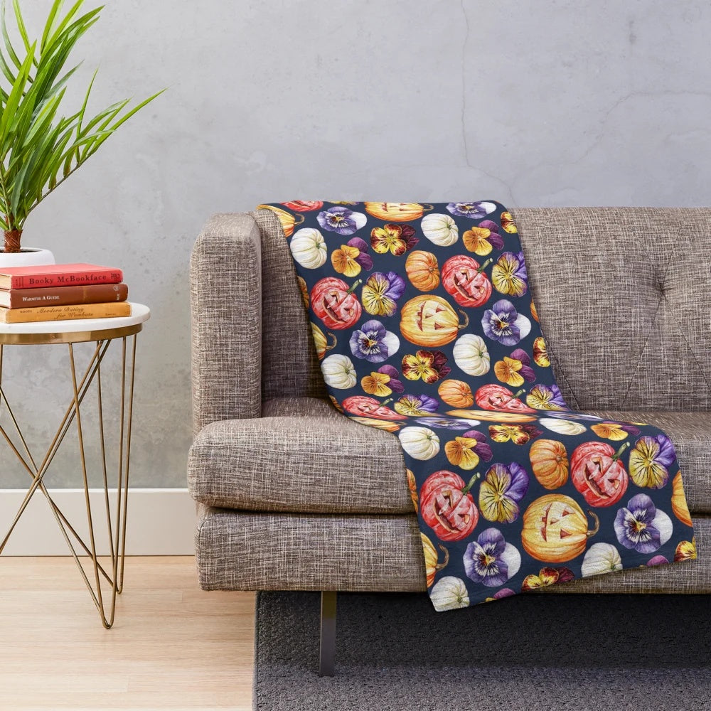 Plush blanket with watercolor pattern of pumpkins and pansies