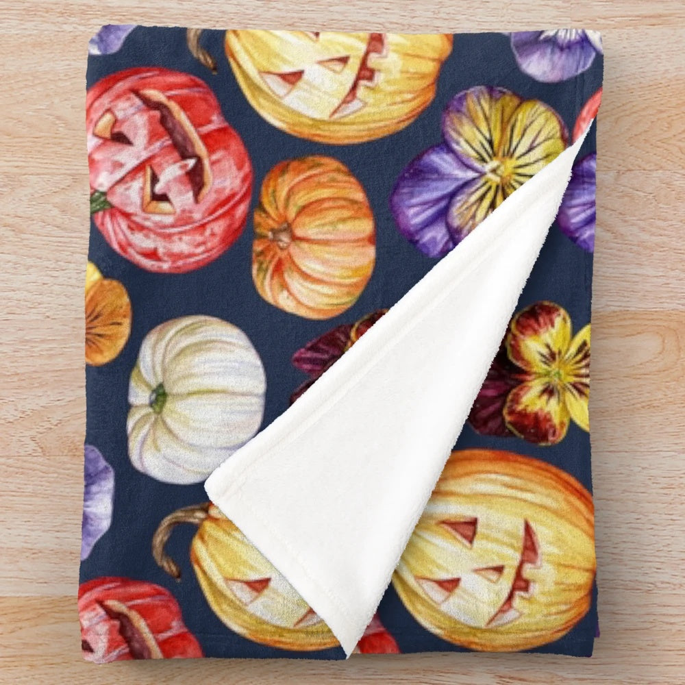 Plush blanket with watercolor pattern of pumpkins and pansies