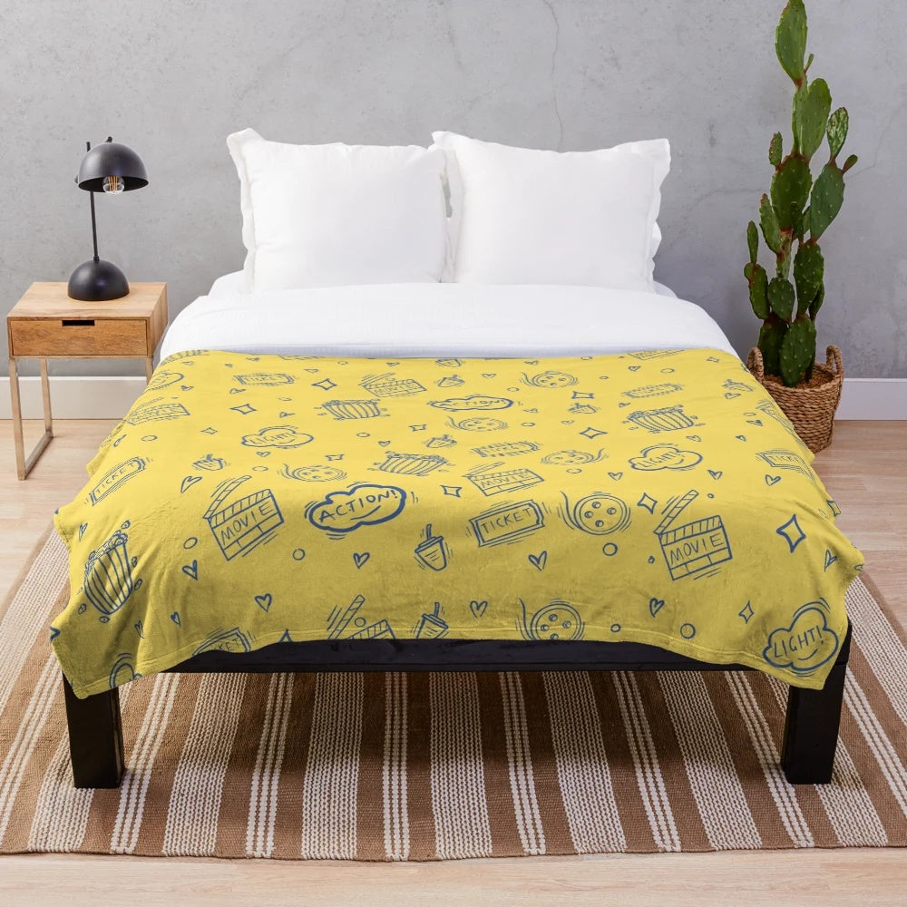 Plush blanket with retro movie and cinema inspired pattern