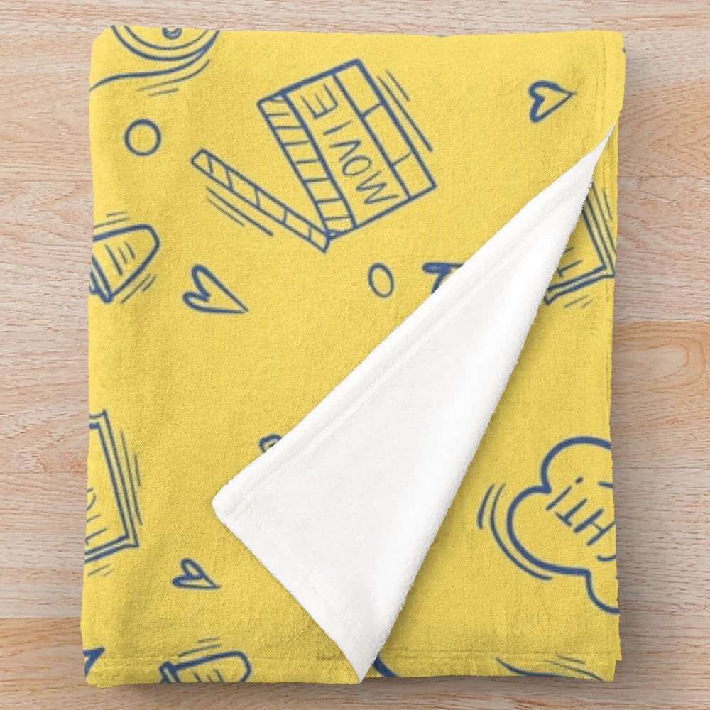 Plush blanket with retro movie and cinema inspired pattern