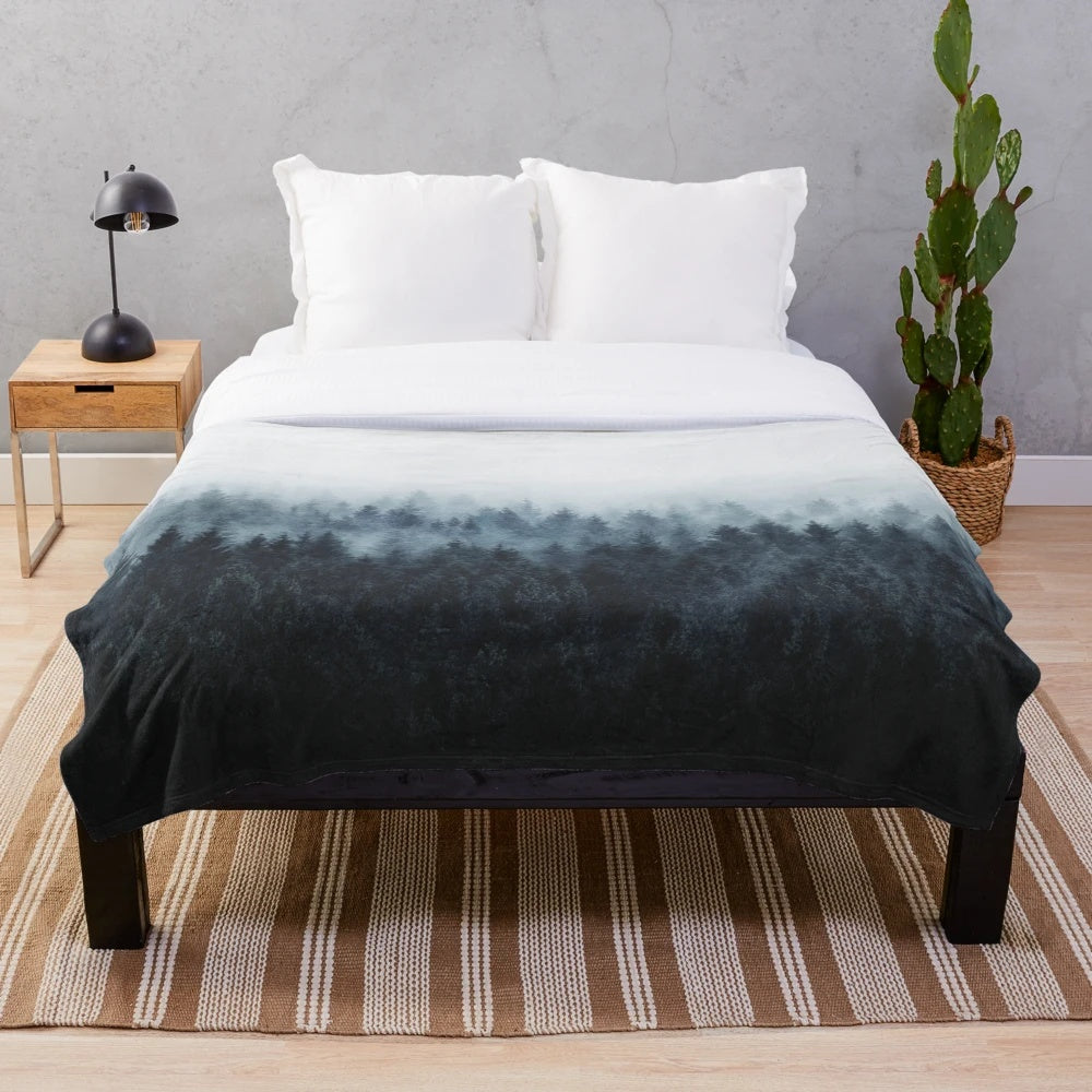 Soft and cozy plush blanket with a whimsical forest and nature design