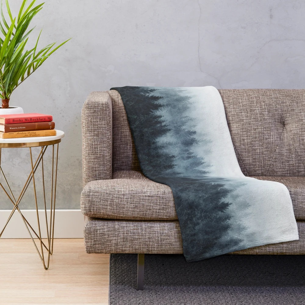 Soft and cozy plush blanket with a whimsical forest and nature design