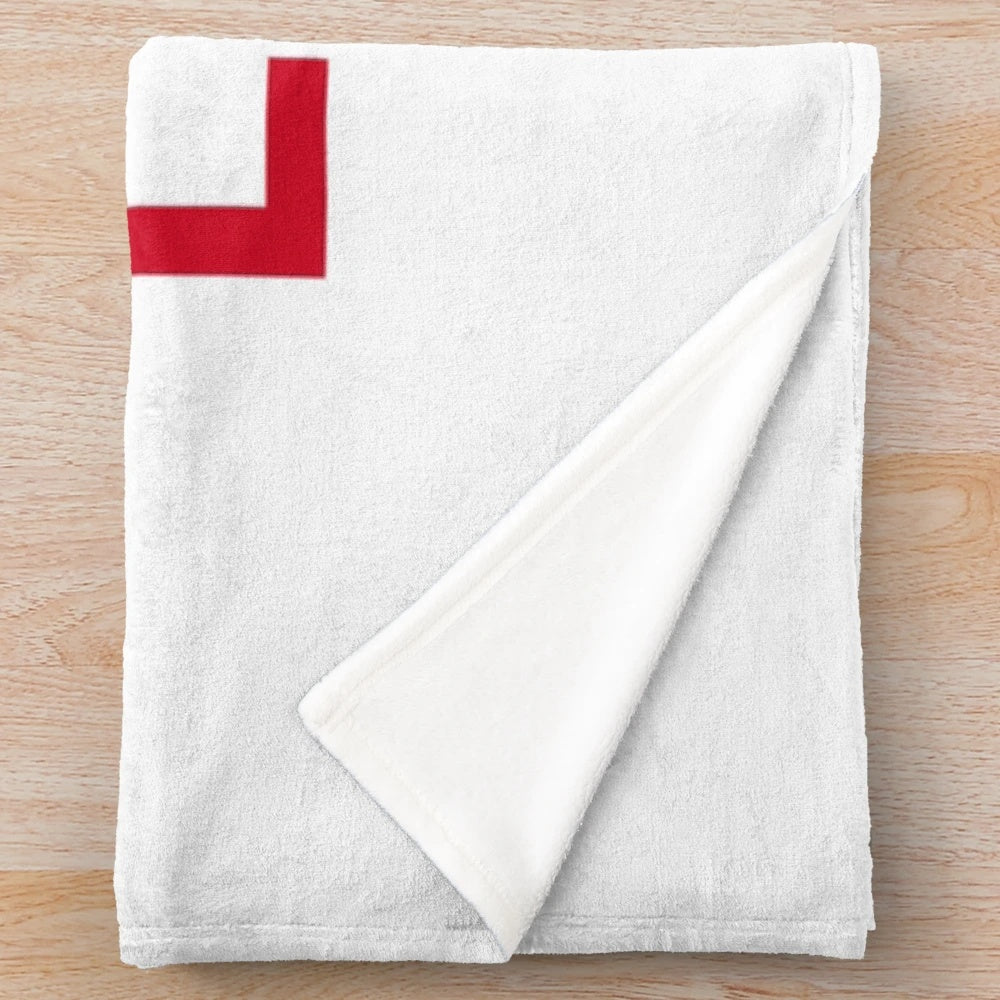 Plush blanket with coastal scene inspired by the Royal National Lifeboat Institution flag