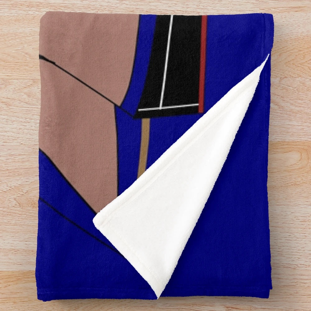 Plush blanket with sailing barge motif for nautical home decor