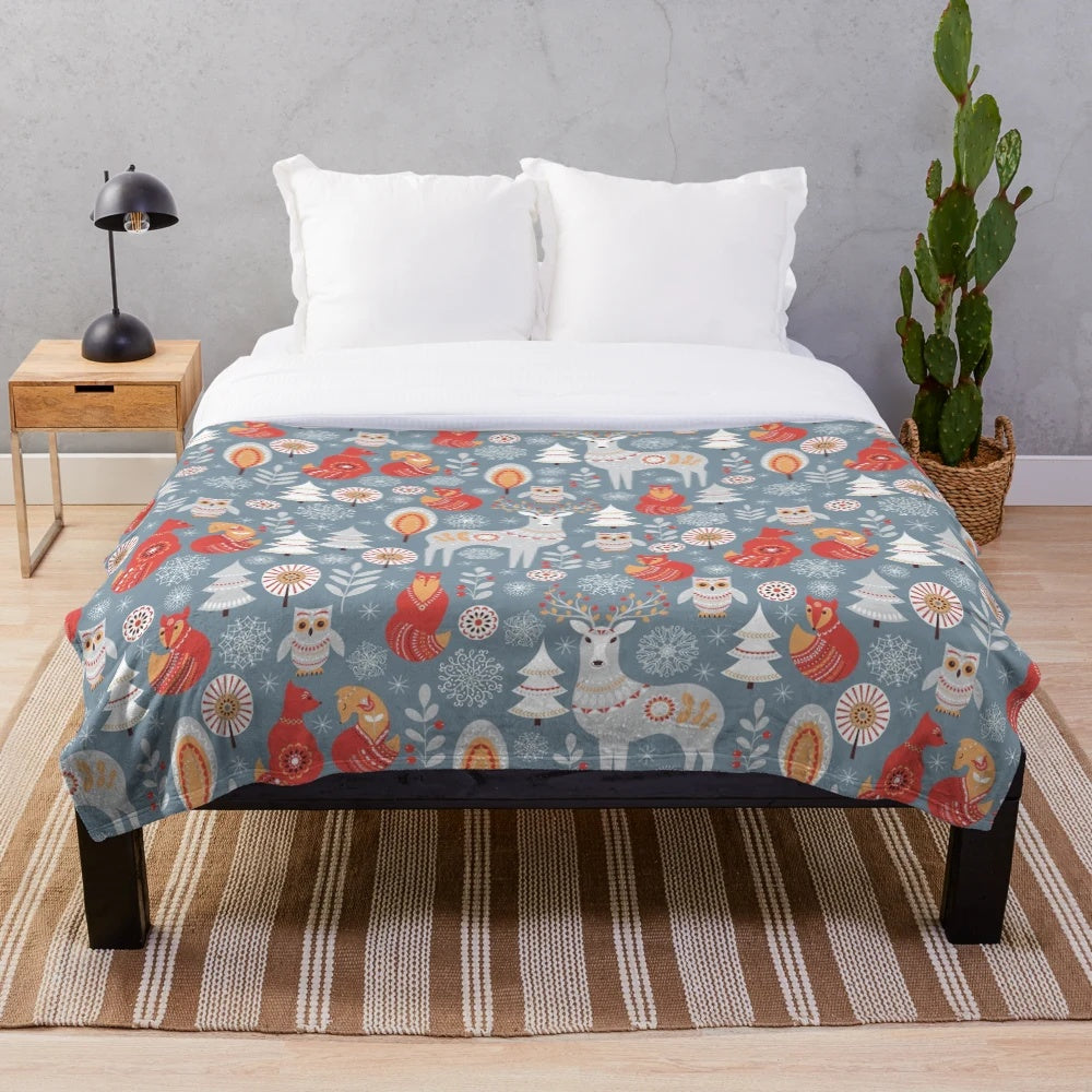 Plush blanket with seamless pattern of winter forest, deer, owl and fox in Scandinavian style