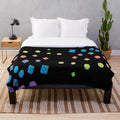 Plush blanket with a colorful scattered dice pattern