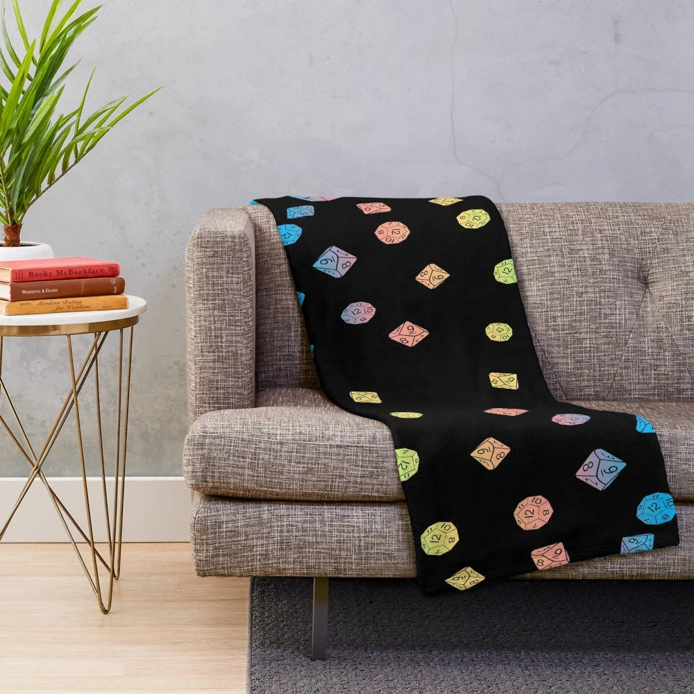 Plush blanket with a colorful scattered dice pattern