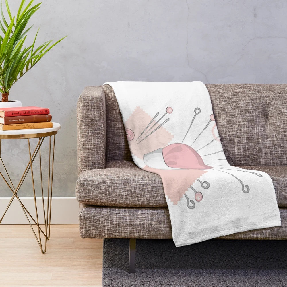 Pink plush blanket with sewing accessories
