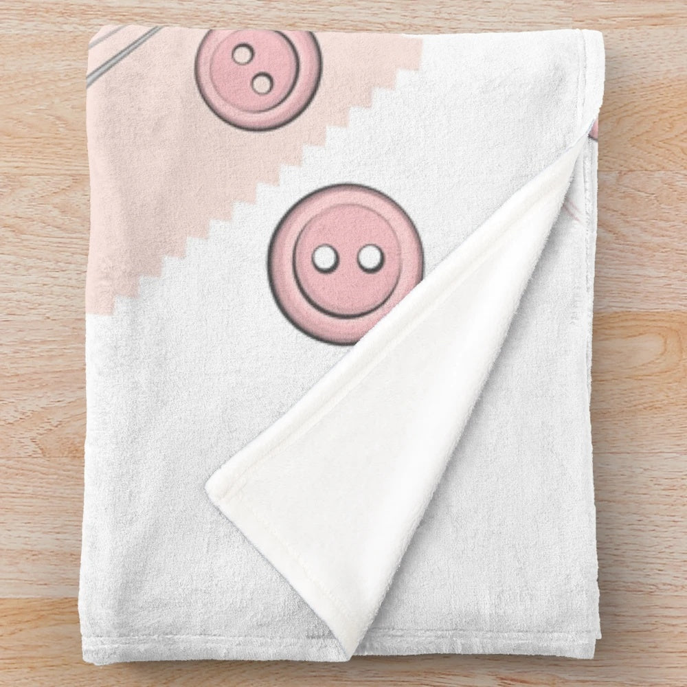 Pink plush blanket with sewing accessories