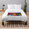 Plush blanket with intricately woven spools of thread design