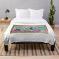 Plush blanket with floral and nature inspired patterns