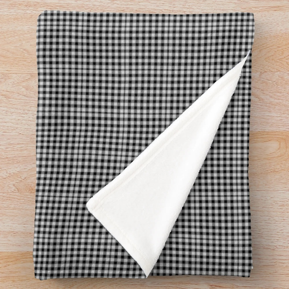 Soft and plush black and white Scottish plaid blanket