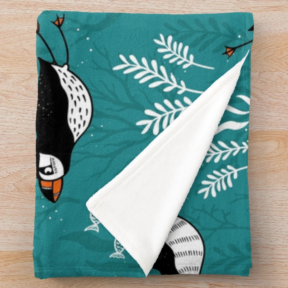 Plush blanket featuring a puffin swimming underwater in an arctic ocean scene